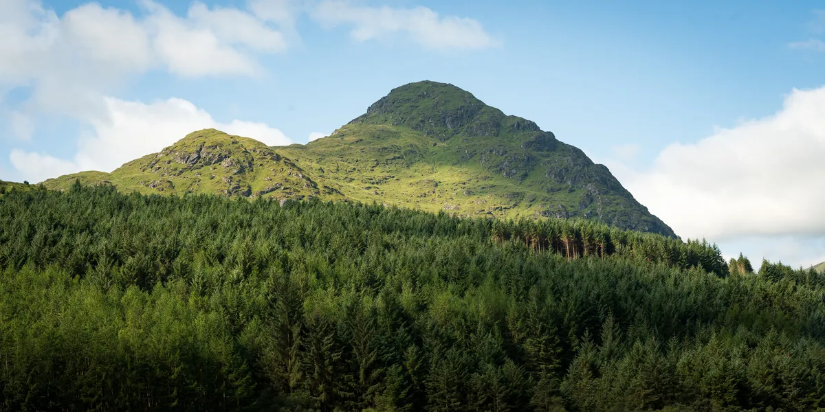 The walk in past Loch Sloy dam offers stunning views across the Arrochar Alps