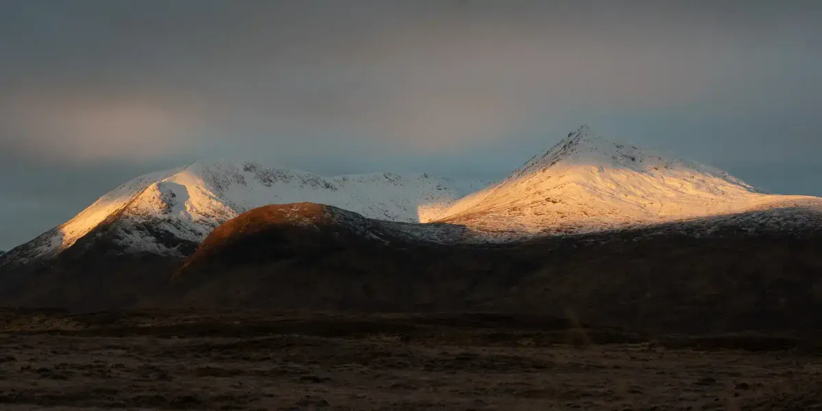 Spectacular sunrise over the Glencoe mountains on the drive up